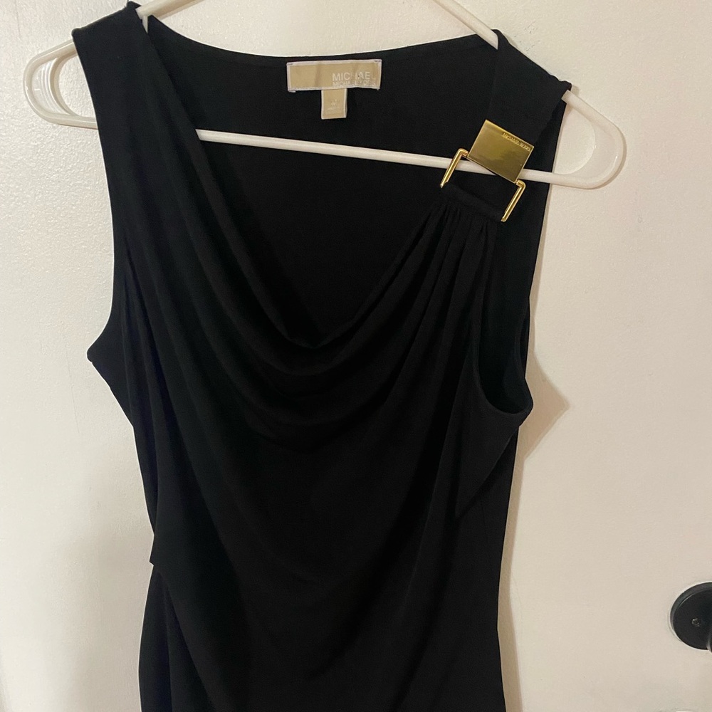 MICHAEL KORS black top w/a Michael Kors gold emblem on the left shoulder